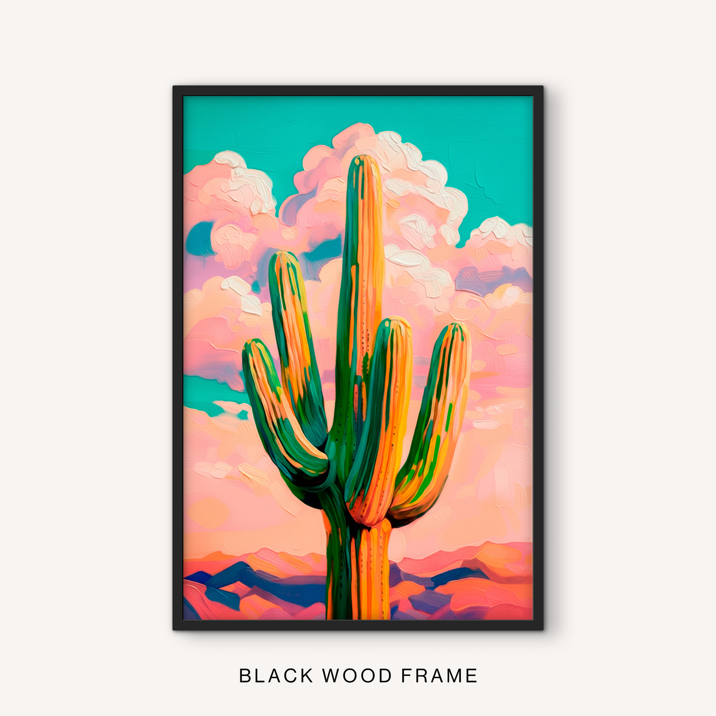 Bold cactus print in a black frame featuring a modern western desert scene, tall saguaro, pink sky, and vibrant southwestern colors.