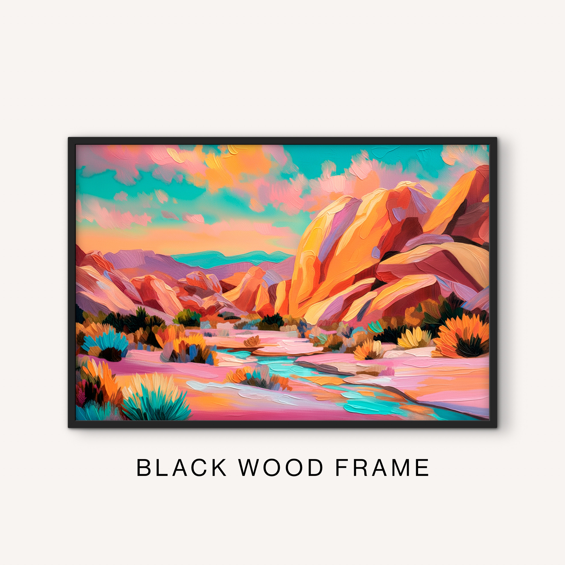 Bold desert mountain print in a black frame featuring a colorful western canyon landscape, turquoise stream, pink sand, and vibrant sky.