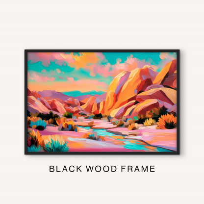 Bold desert mountain print in a black frame featuring a colorful western canyon landscape, turquoise stream, pink sand, and vibrant sky.