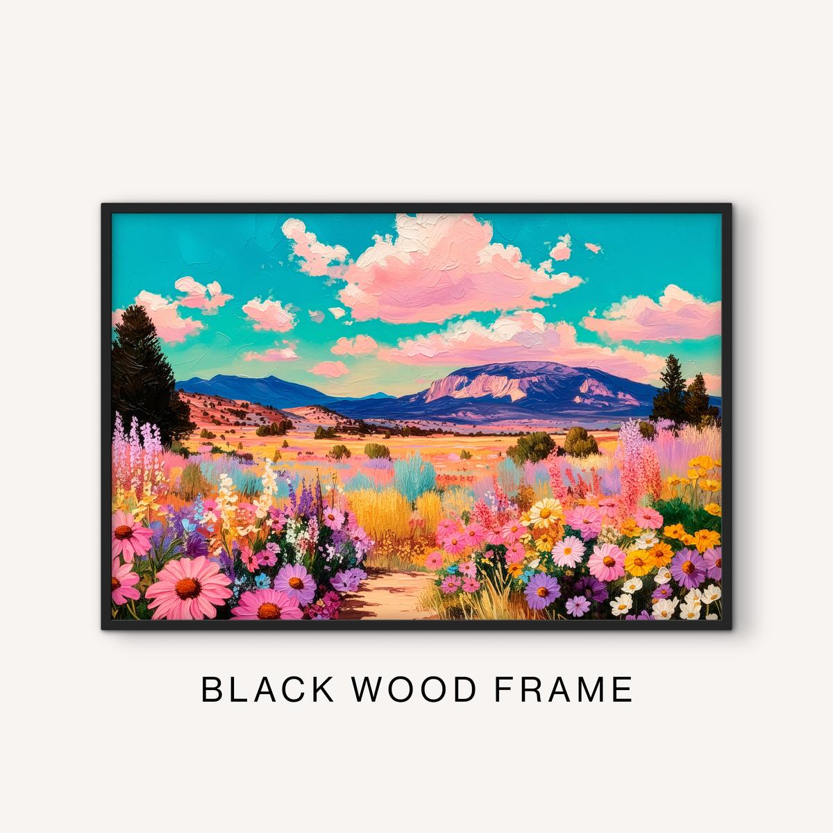 Bold floral landscape print in a black frame featuring a colorful western meadow, mountain scenery, pink clouds, and bright prairie flowers.