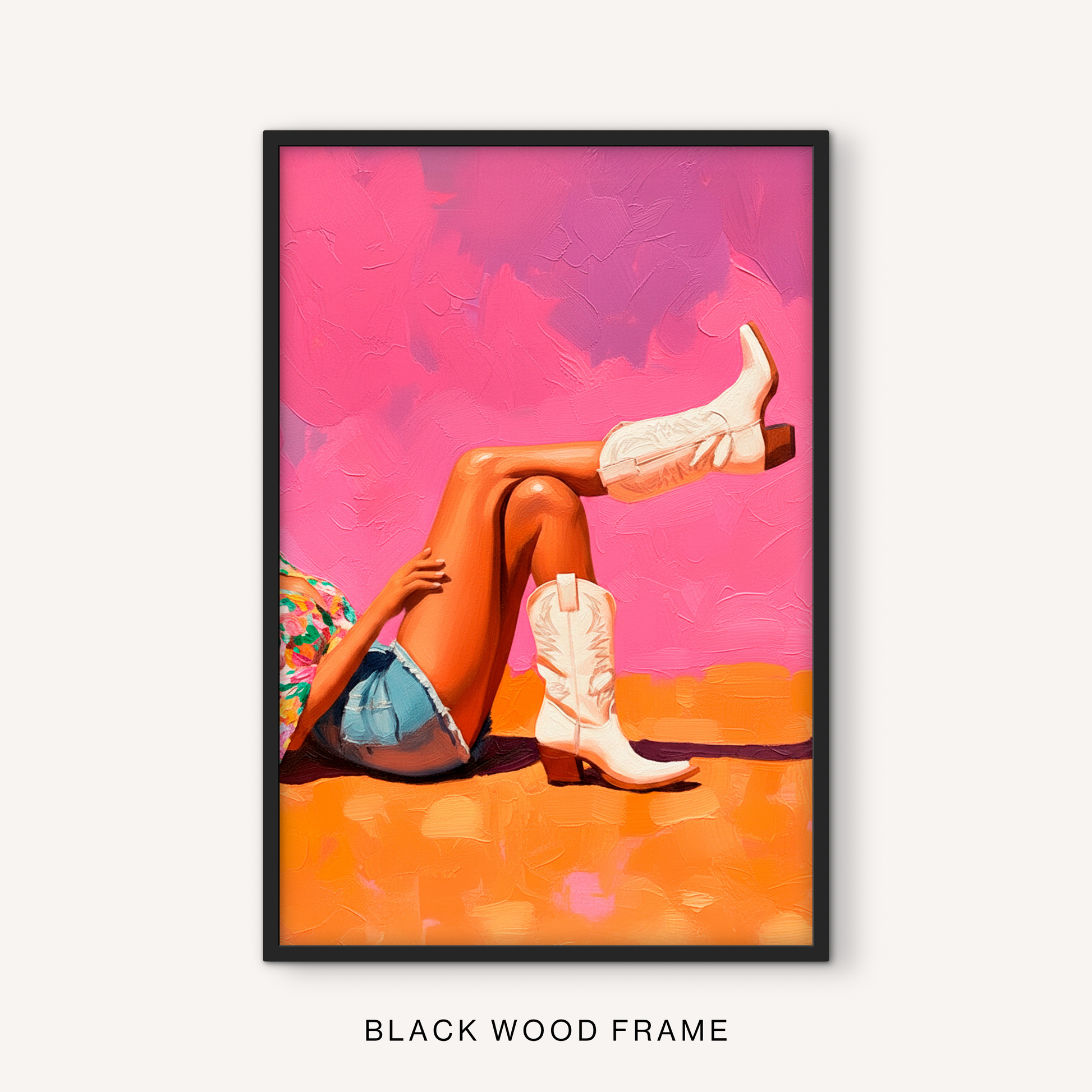 Bold western boots print in a black frame featuring white cowgirl boots, hot pink background, orange tones, and playful western wall decor.
