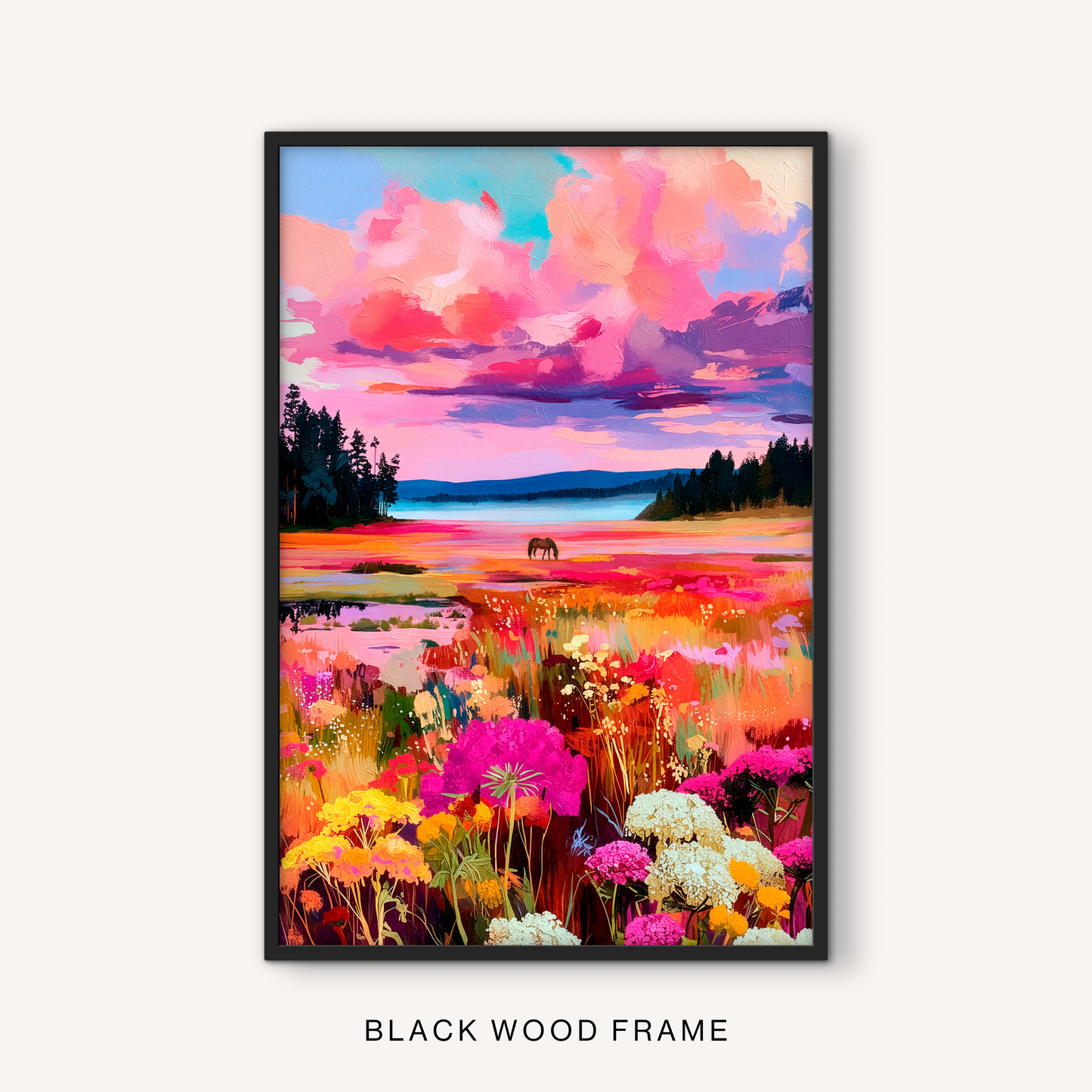 Bold western landscape print in a black frame featuring a colorful wildflower meadow, calm lake, pink sky, and distant horse scenery.