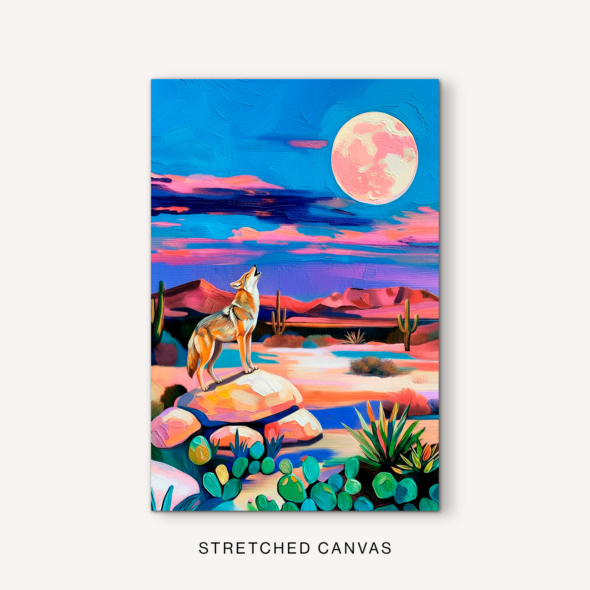 Colorful desert moon canvas art with a howling coyote, cactus plants, vivid blue sky, pink clouds, and western wildlife decor style.