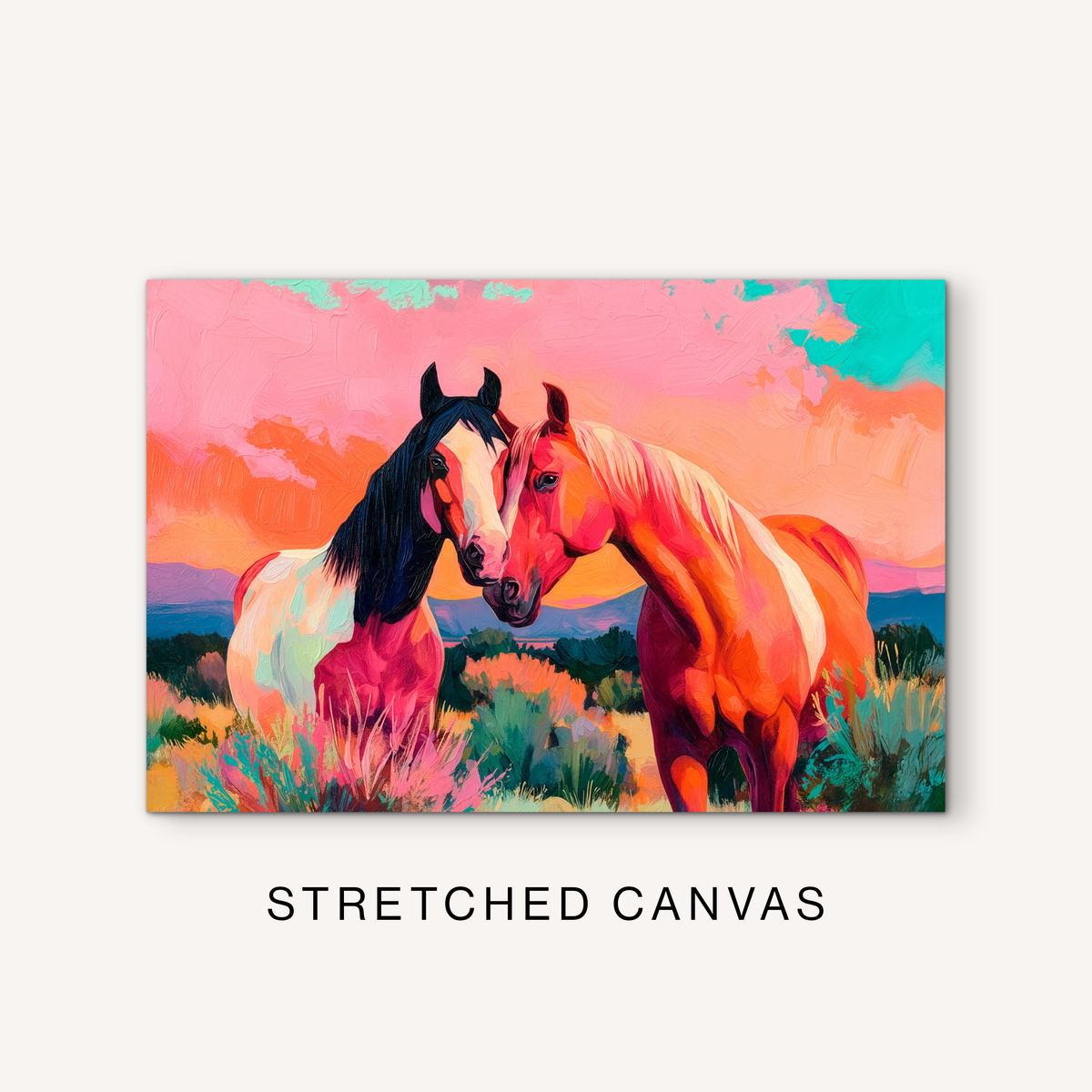 Colorful two horse canvas art with boho western style, warm pink and orange tones, desert brush, and mountain ranch scenery.