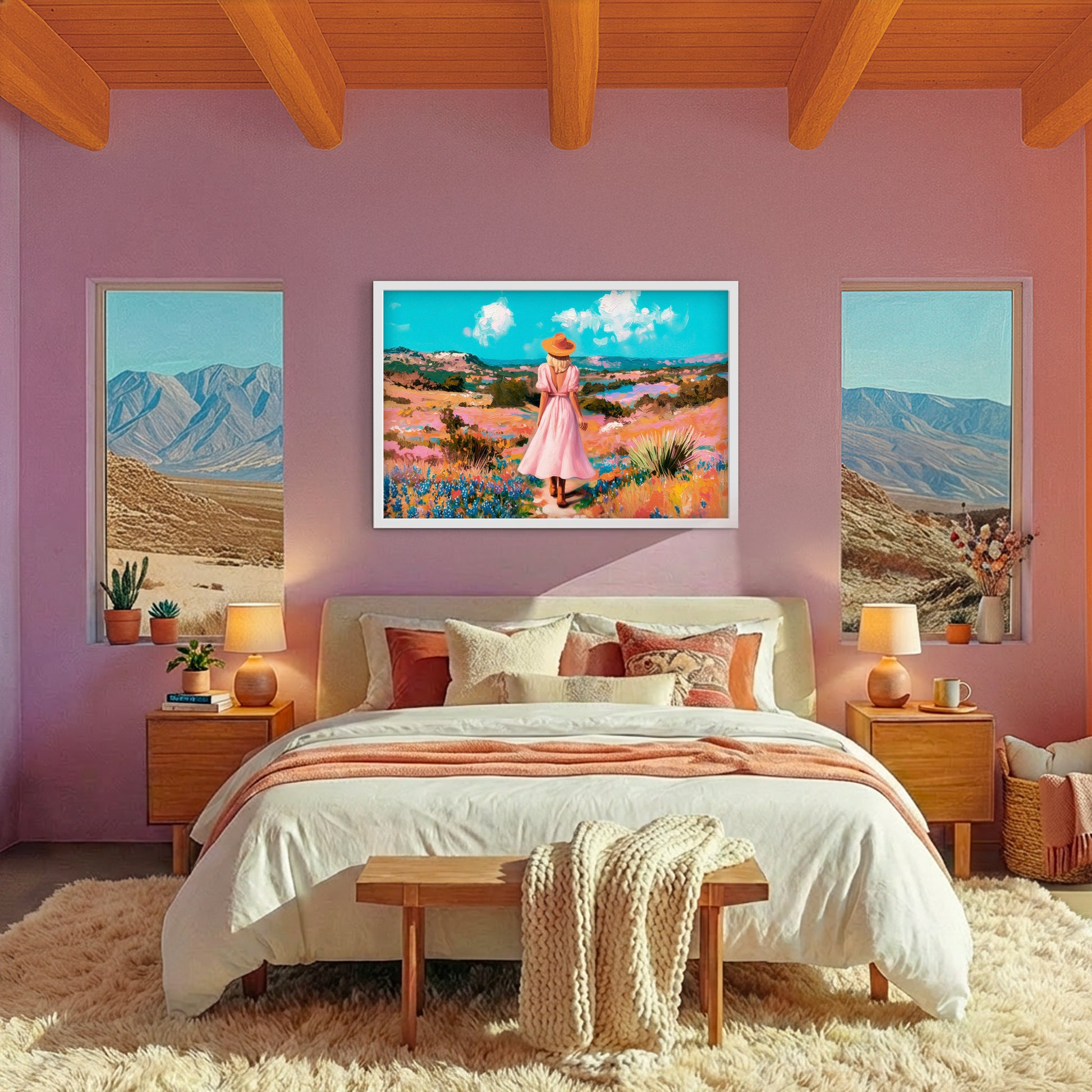 Western cowgirl artwork featuring a woman walking through colorful wildflowers, styled above a bed in a feminine southwestern bedroom.