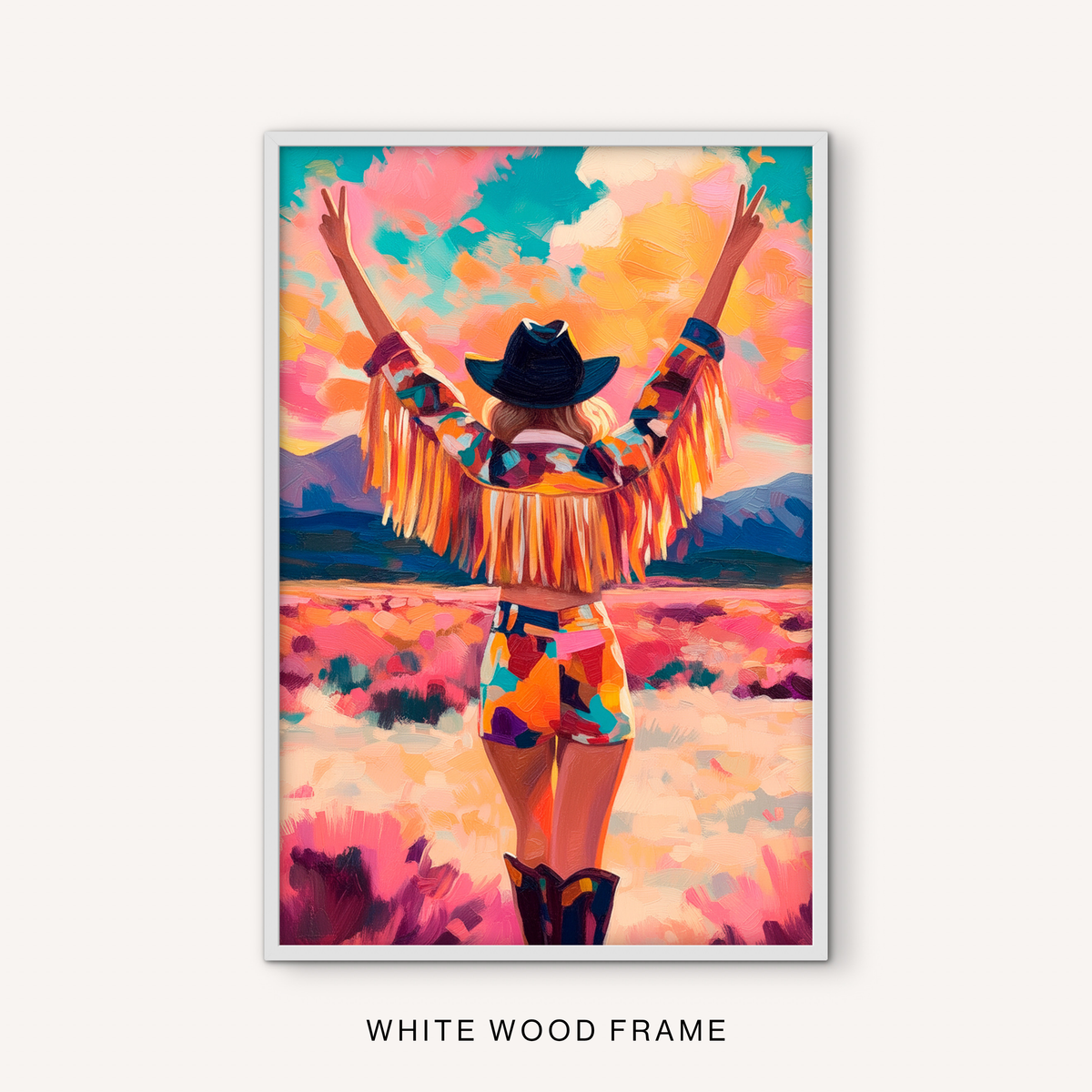 Colorful cowgirl wall art in a white frame with a fringe jacket, western hat, pink sky, and bright ranch-inspired landscape.