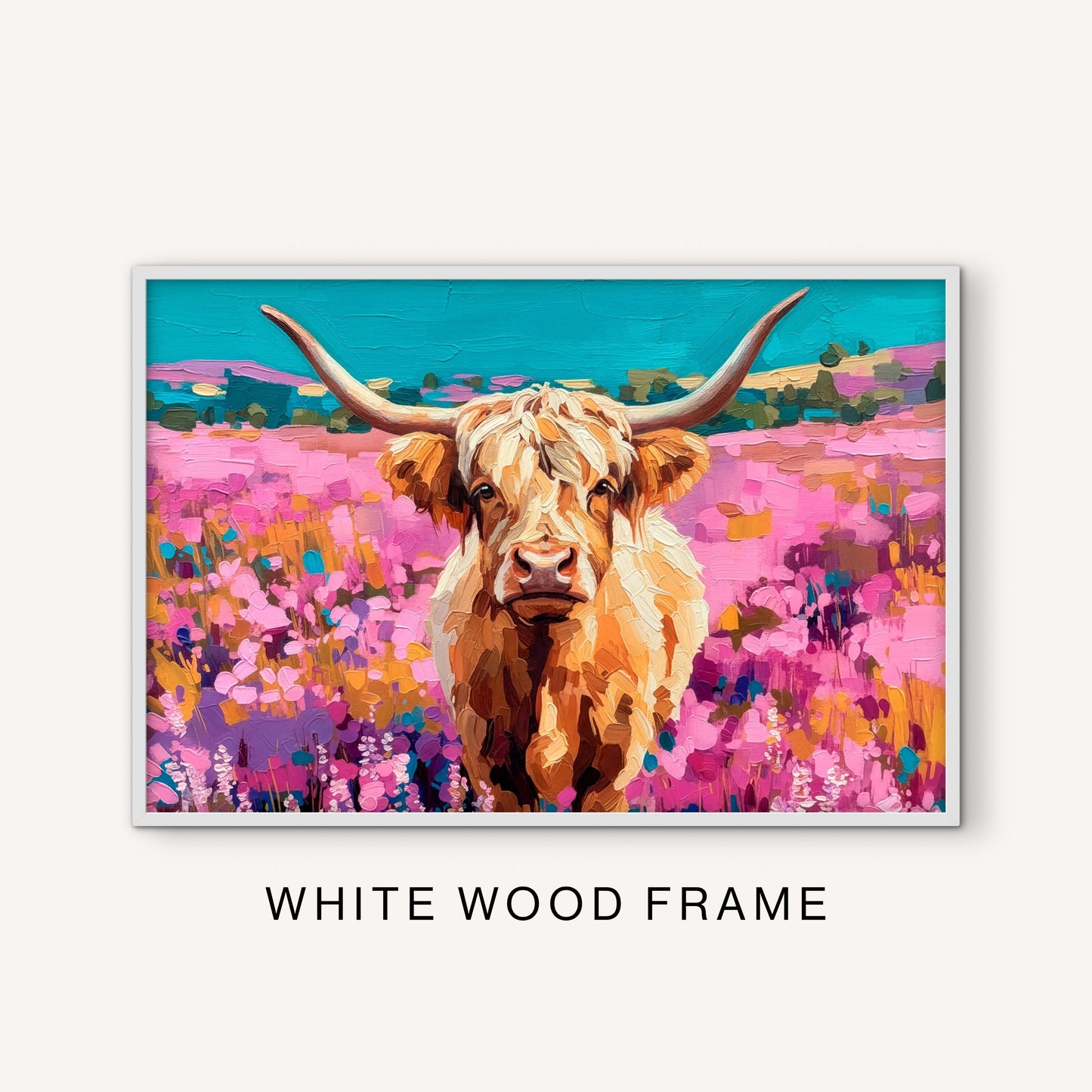 Bright western Highland cow wall art in a white frame with a colorful ranch landscape, pink flowers, long horns, and turquoise sky.