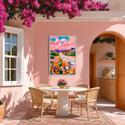 Pink sky desert road wall art displayed in a sunny southwestern patio with rattan chairs and bougainvillea.