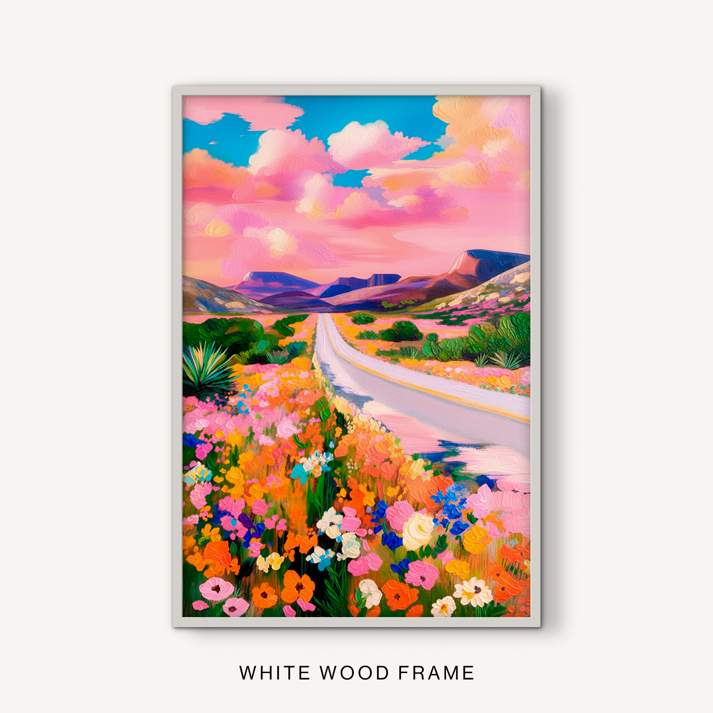 Pink sky desert landscape print in a white frame with vibrant flowers, turquoise clouds, and western scenery.