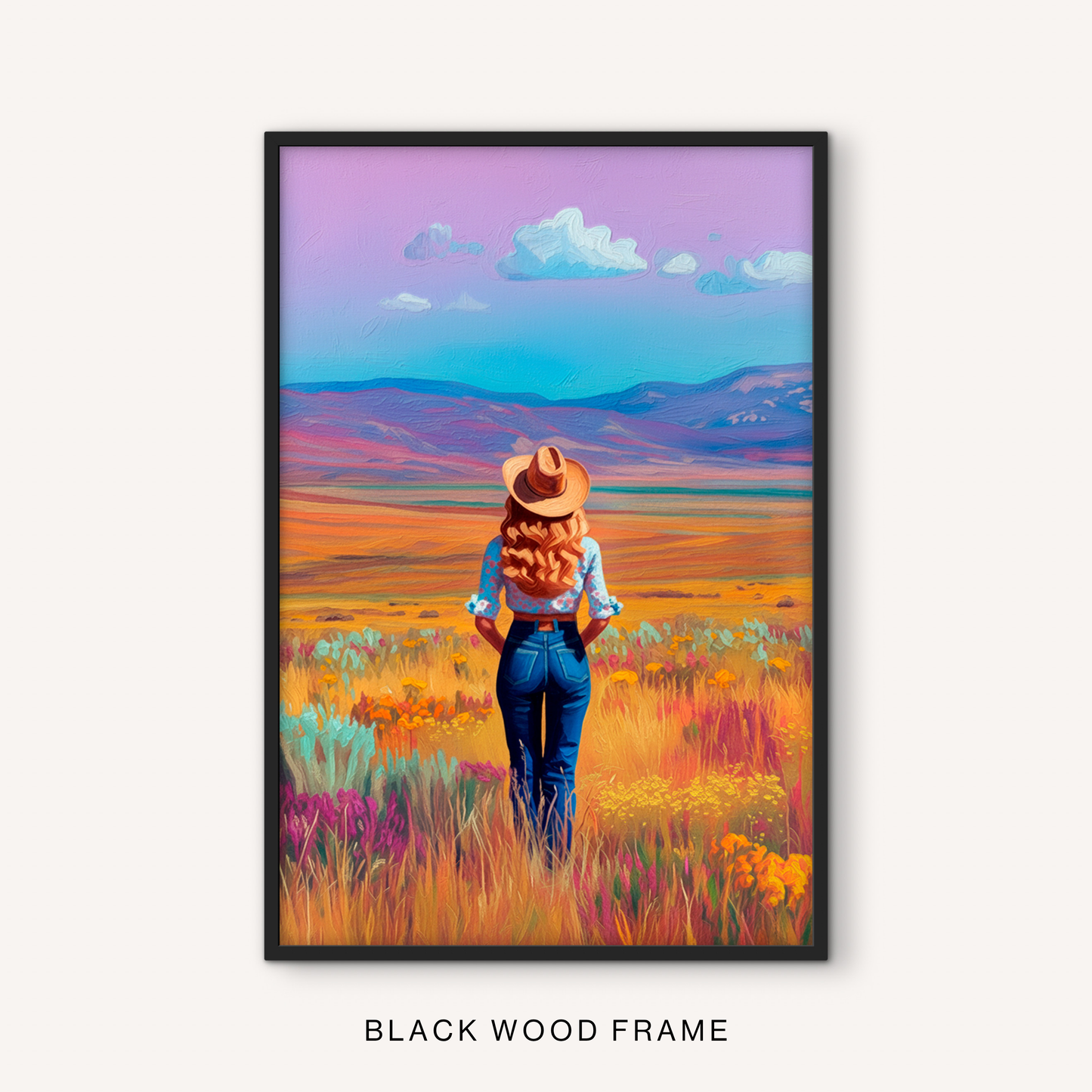Rustic western cowgirl print in a black frame featuring a colorful prairie landscape, wildflower field, distant mountains, and ranch-inspired style.